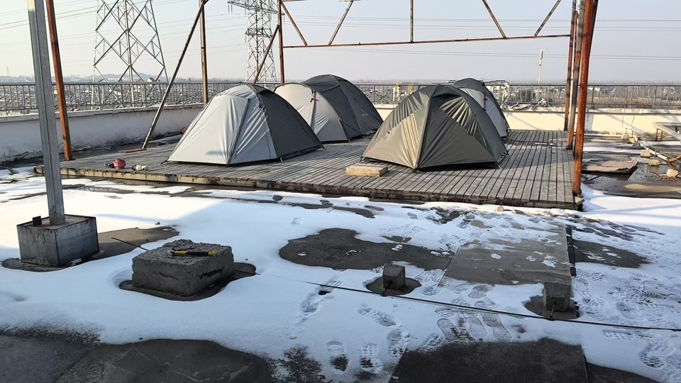 Camping tents undergoing cold weather field testing in OEM tent factory to ensure durability and quality control