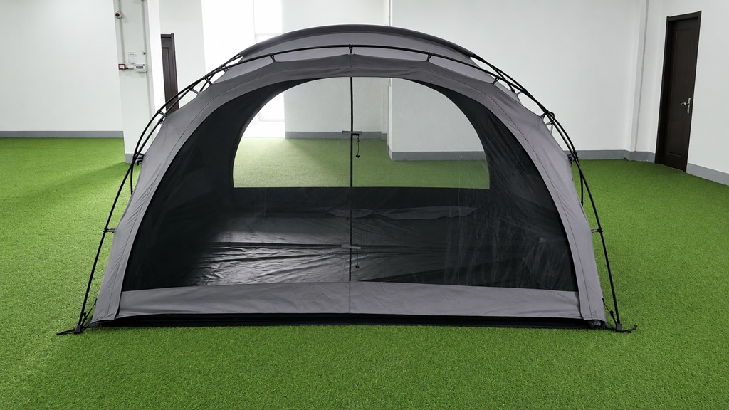 Front view of gray glamping tent with mesh door