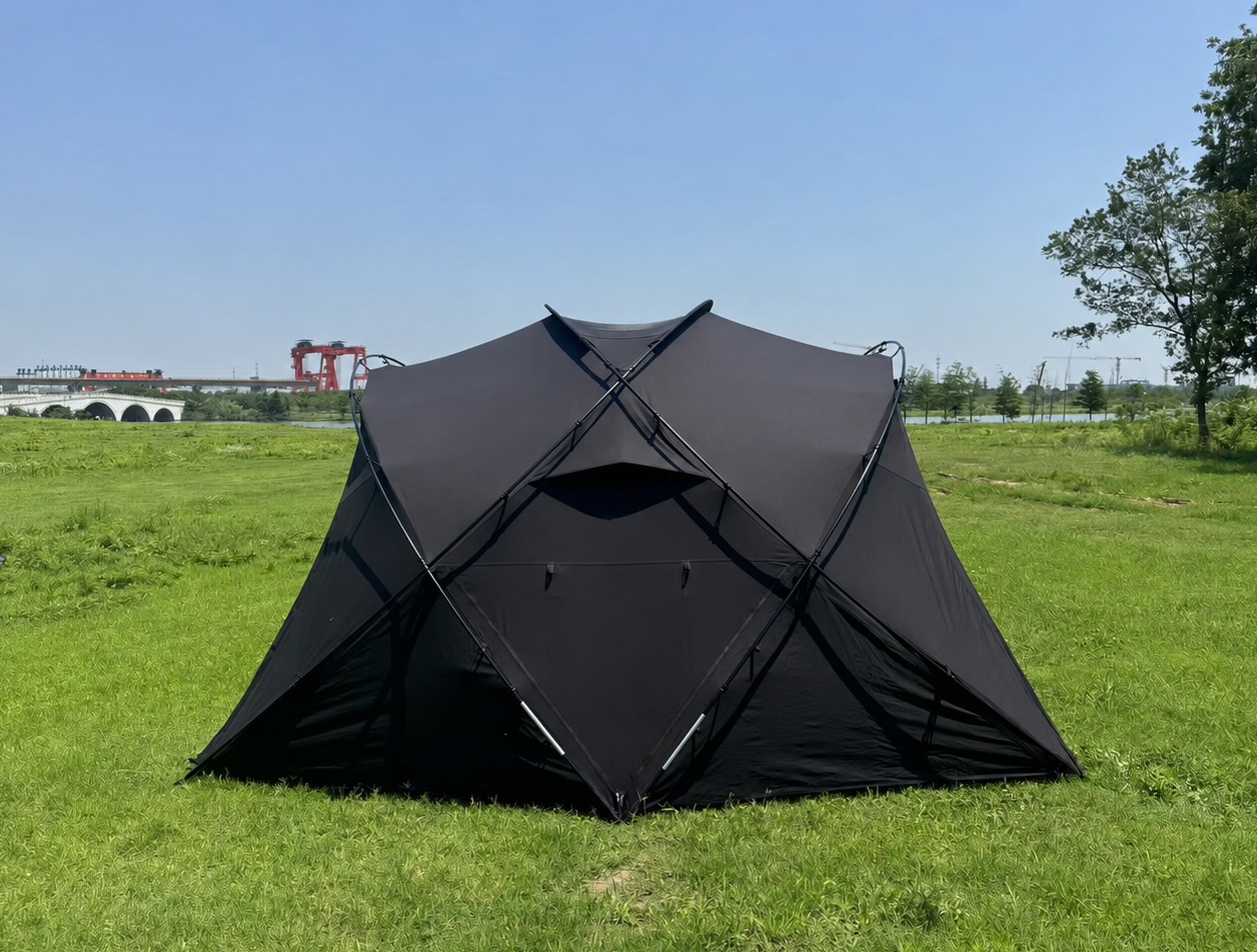 Rear view of black glamping tent in outdoor environment