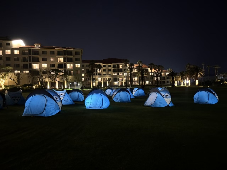NastoCamp camping tents deployed at a nighttime outdoor event site by a customer in South Korea.