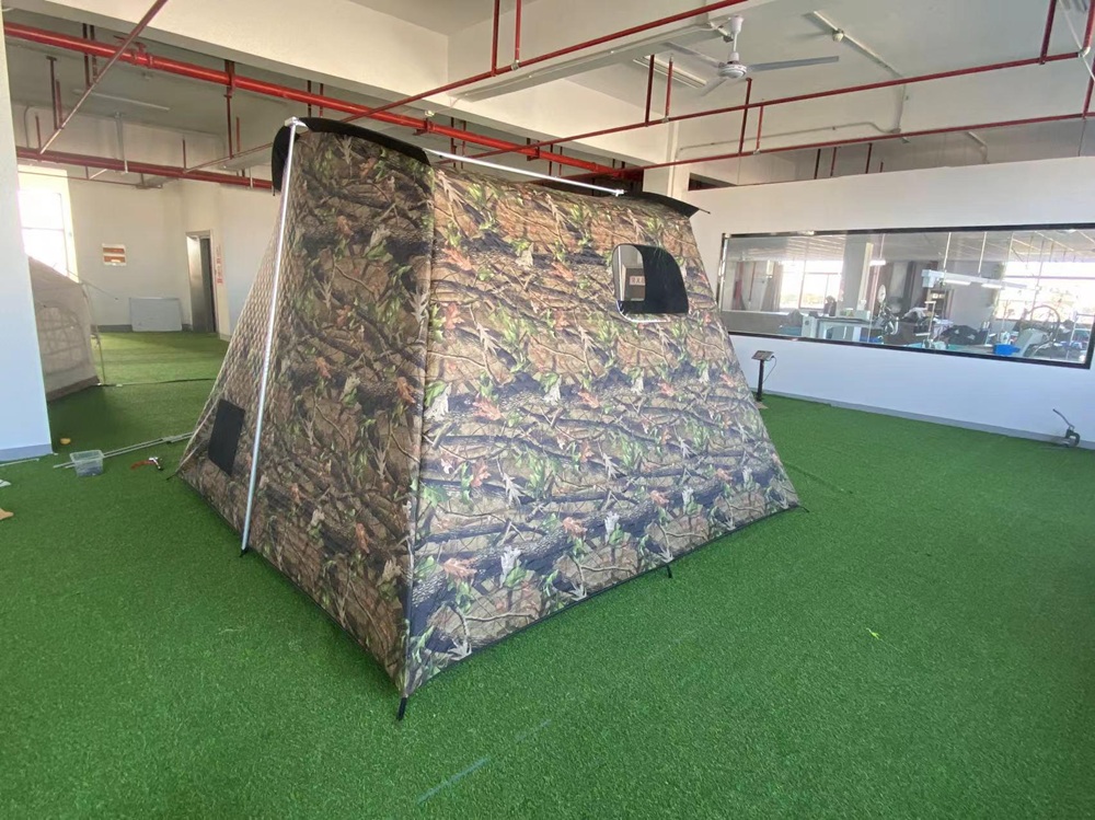 NC-SU-0008 insulated camouflage hunting tent displayed in NastoCamp showroom