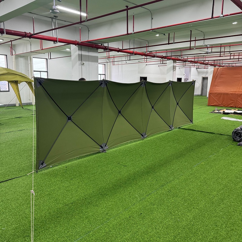NC-TO-0001 camping windbreak displayed in NastoCamp showroom with foldable panel structure