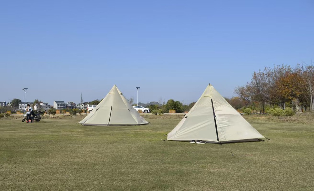 Classic tipi tent structure demonstrating a traditional single-pole camping tent design.