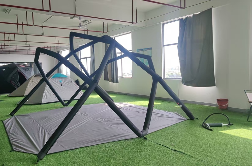 Inflatable tent floor system prepared during OEM tent development