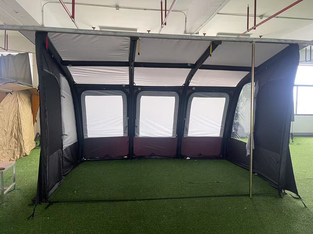 Spacious inflatable vehicle awning interior with panoramic windows