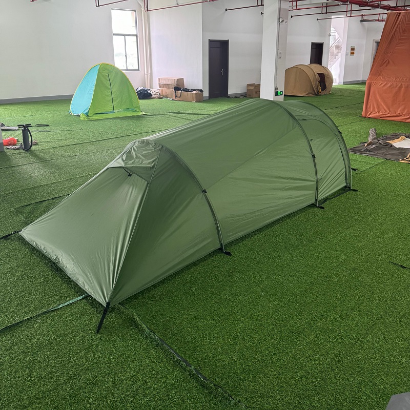 Ultralight tunnel backpacking tent showing rear profile and aluminum pole structure