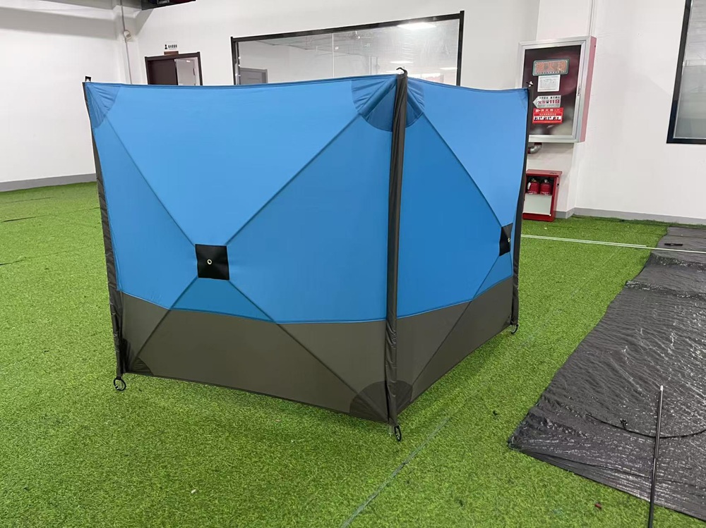 Three-panel camping windbreak screen shown from the exterior