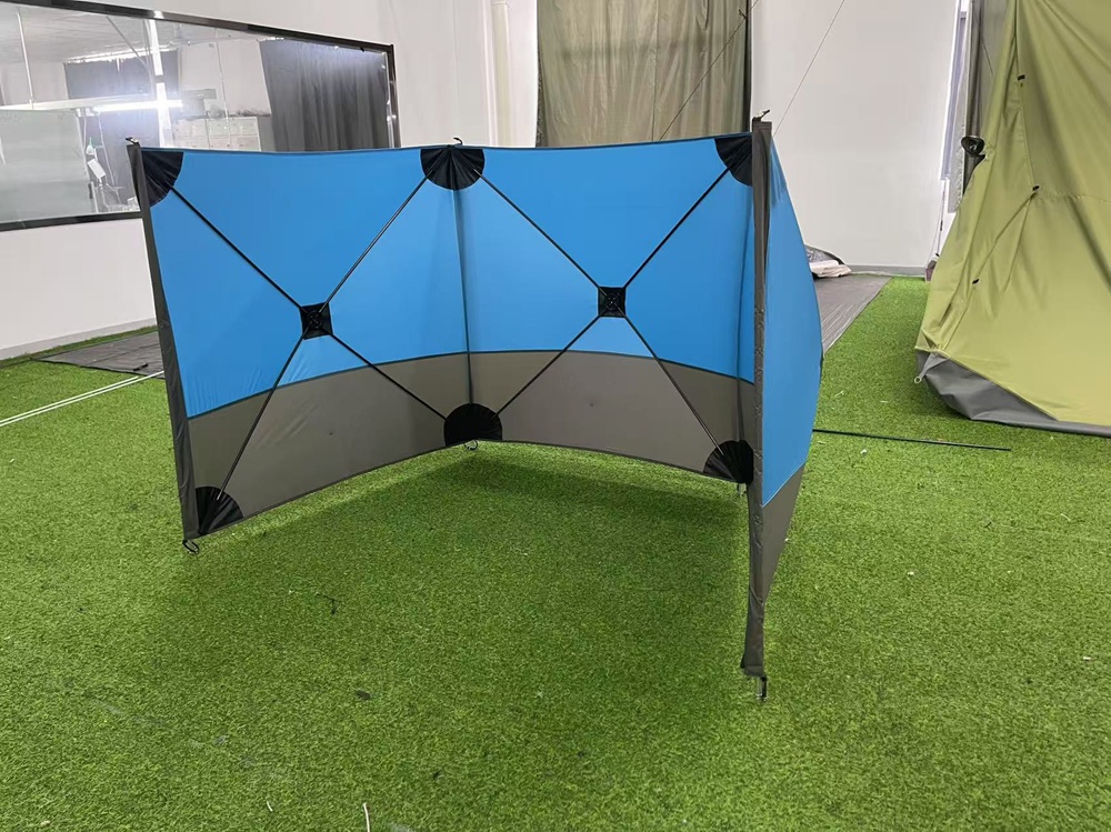 Camping windscreen interior showing folding fiberglass support structure