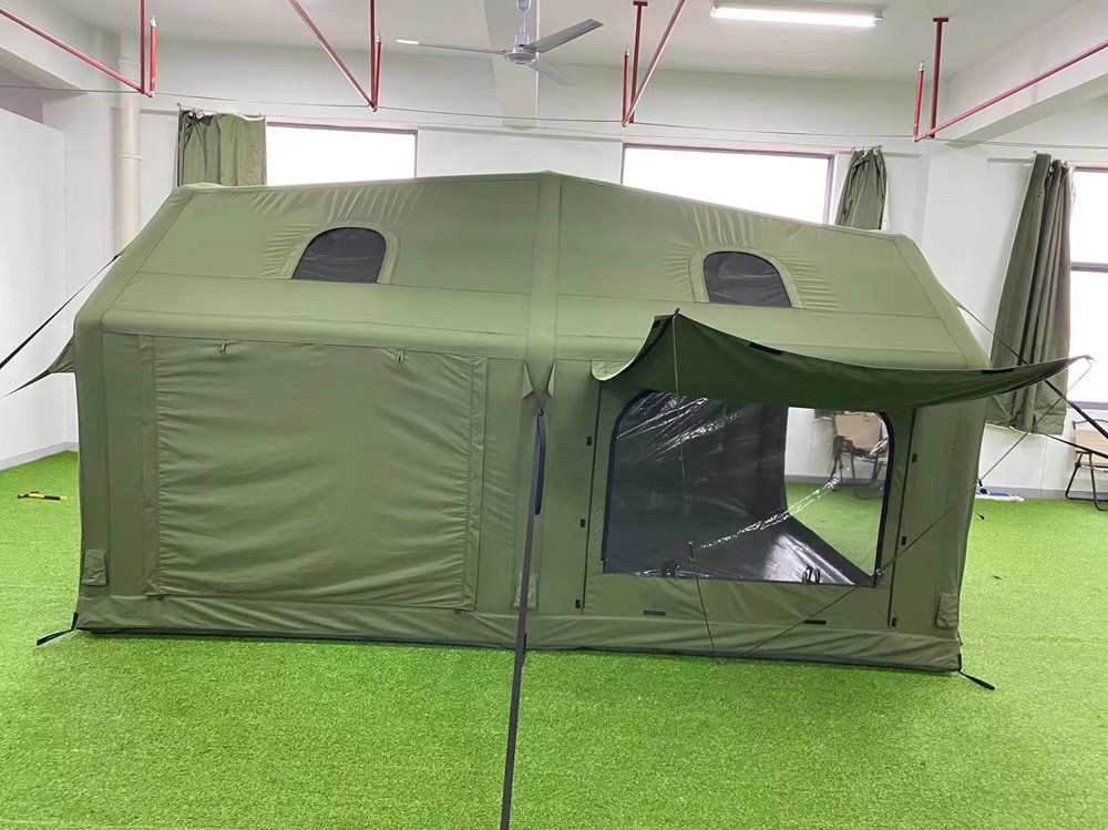 Side view of polycotton inflatable camping tent with raised awning