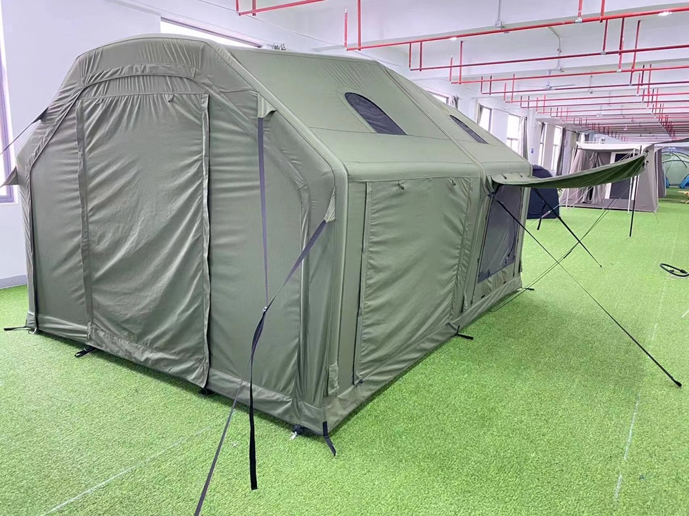 Rear view of green inflatable camping tent showing air-supported structure