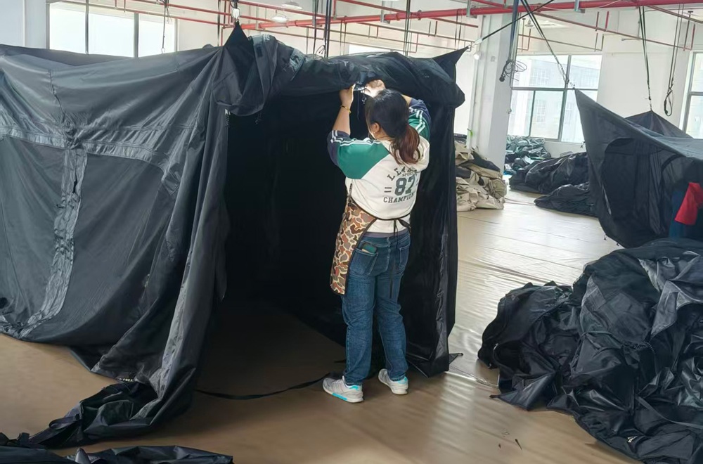 NastoCamp quality control staff inspecting a tent during production