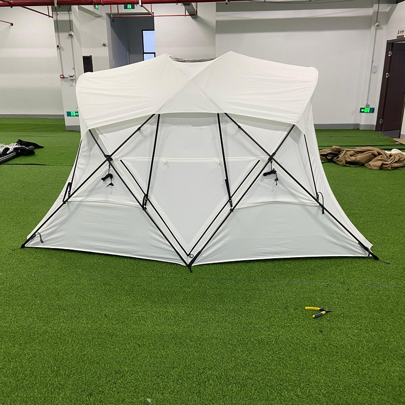 Rear view of semi-spherical dome tent showing aluminum frame structure