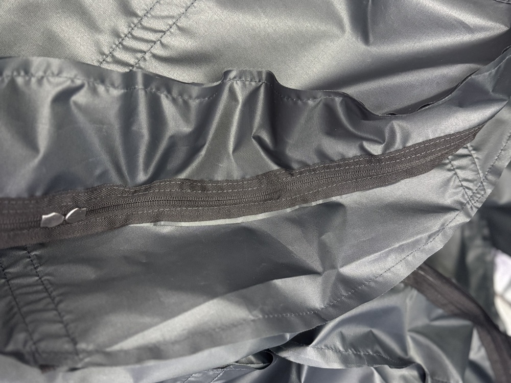 Zipper installed in the fabric construction of a tent