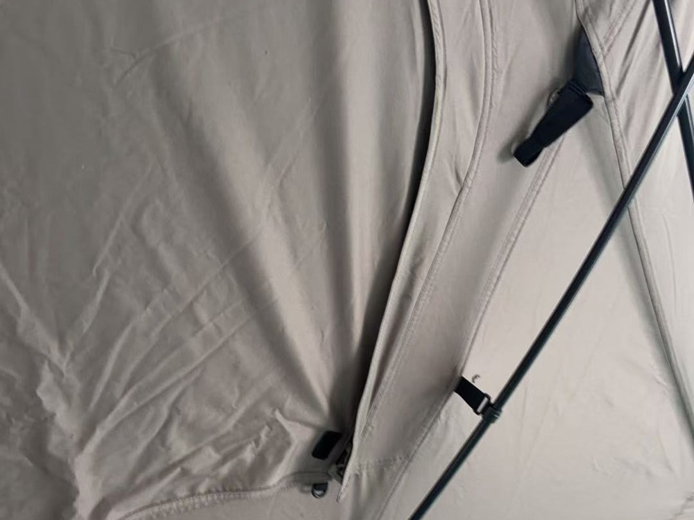 Tent pole structure inside an assembled tent showing how poles support the finished tent