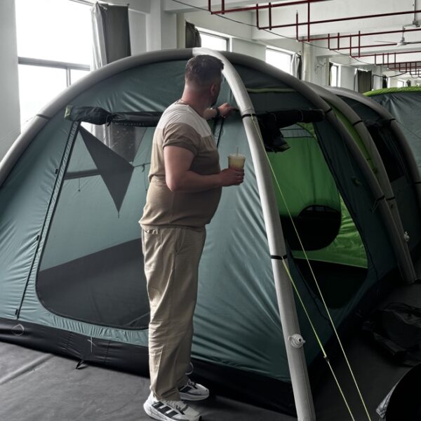 Outdoor brand reviewing a custom inflatable tent prototype at NastoCamp OEM tent factory