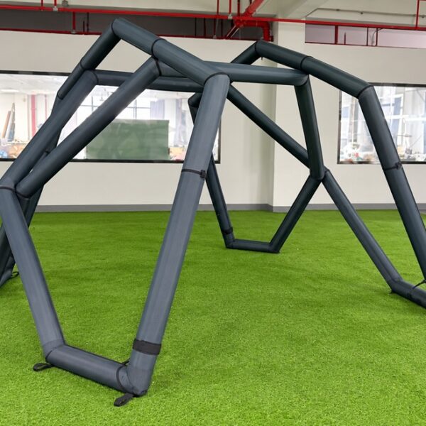 Inflatable tent air-beam frame with interconnected support beams during factory assembly