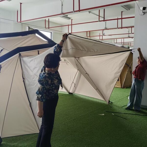 Inflatable Tent Sample Inspection at NastoCamp NastoCamp team checking an assembled inflatable tent at the factory