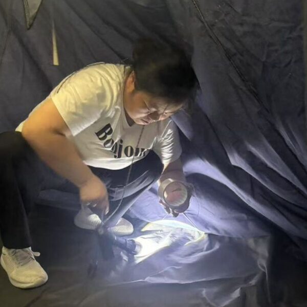 Tent Floor Inspection During OEM Development OEM tent manufacturer inspecting tent floor quality during product development