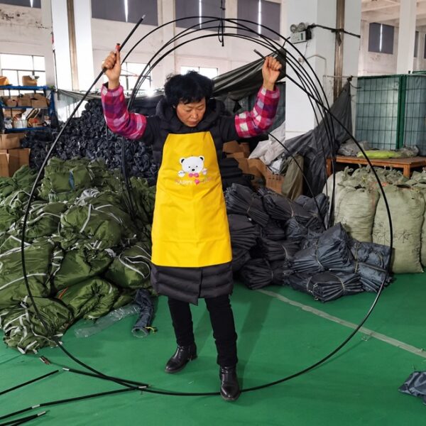 Tent Pole Specifications in OEM Tent Manufacturing Tent poles being handled during OEM tent production at NastoCamp