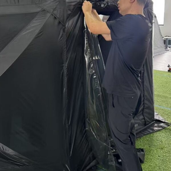 Tent zipper being inspected on a sample tent at NastoCamp